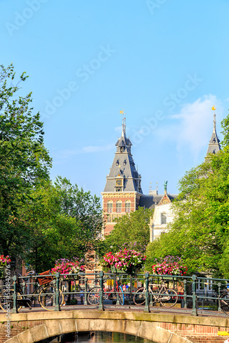 Amsterdam, Netherlands - June 30, 2019: Tower of the Rijksmuseum Museum. Canal (street) Spiegelgracht, Bridge. The historic city center