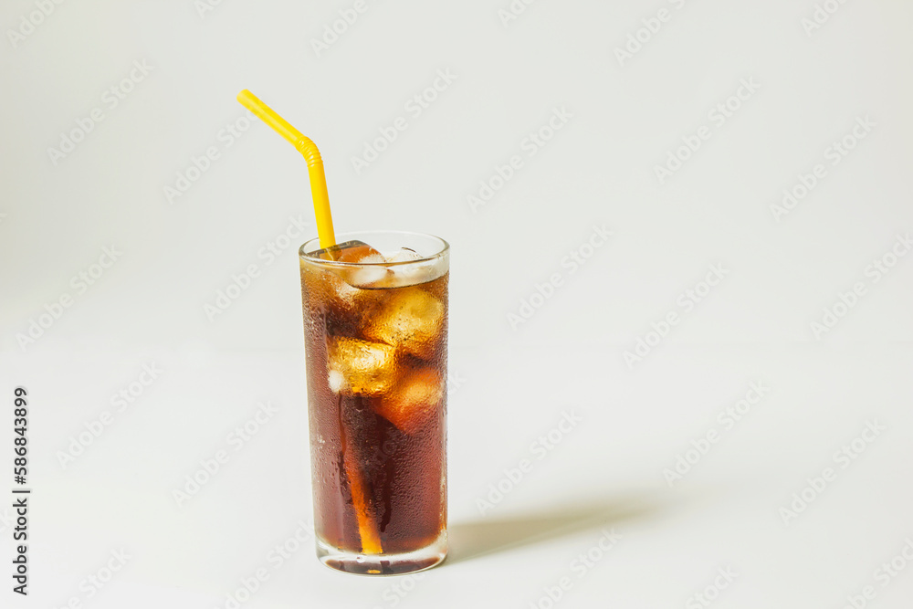 Fresh coke in glass with straw isolated on white background Fresh coke in glass with straw isolated on white background