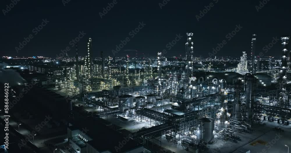 Aerial view of industrial area buildings scenery at night. Oil and gas petrochemical industrial with Refinery factory. Aerial view of industrial area buildings scenery at night. Oil and gas petrochemical industrial with Refinery factory.