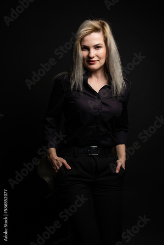woman in black on a black background