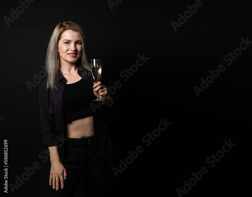 woman with a glass on a black background