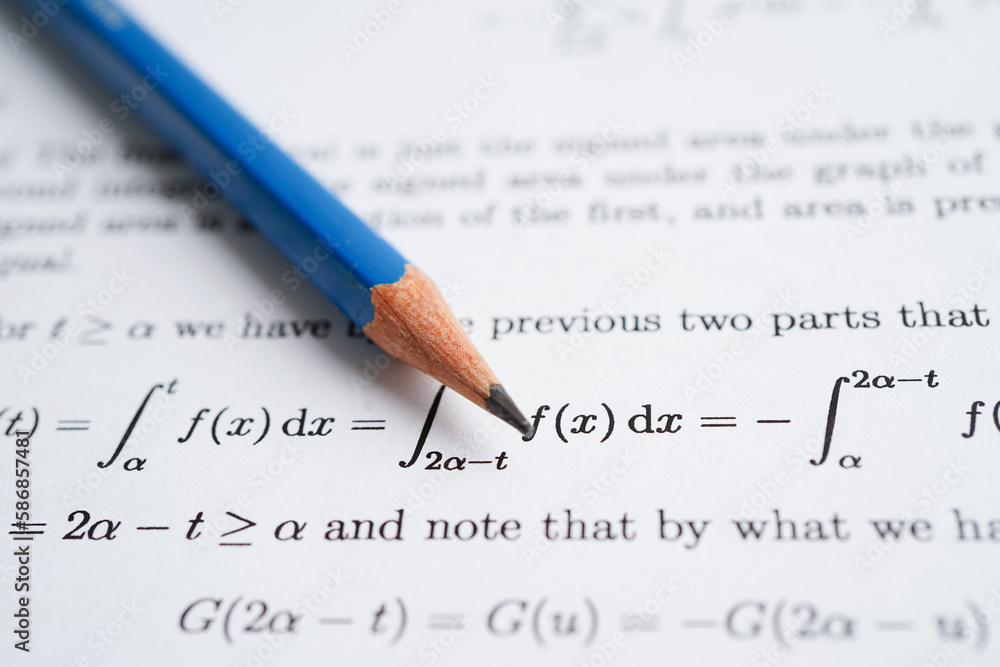 Pencil on mathematic formula exercise test paper in education school. Pencil on mathematic formula exercise test paper in education school.