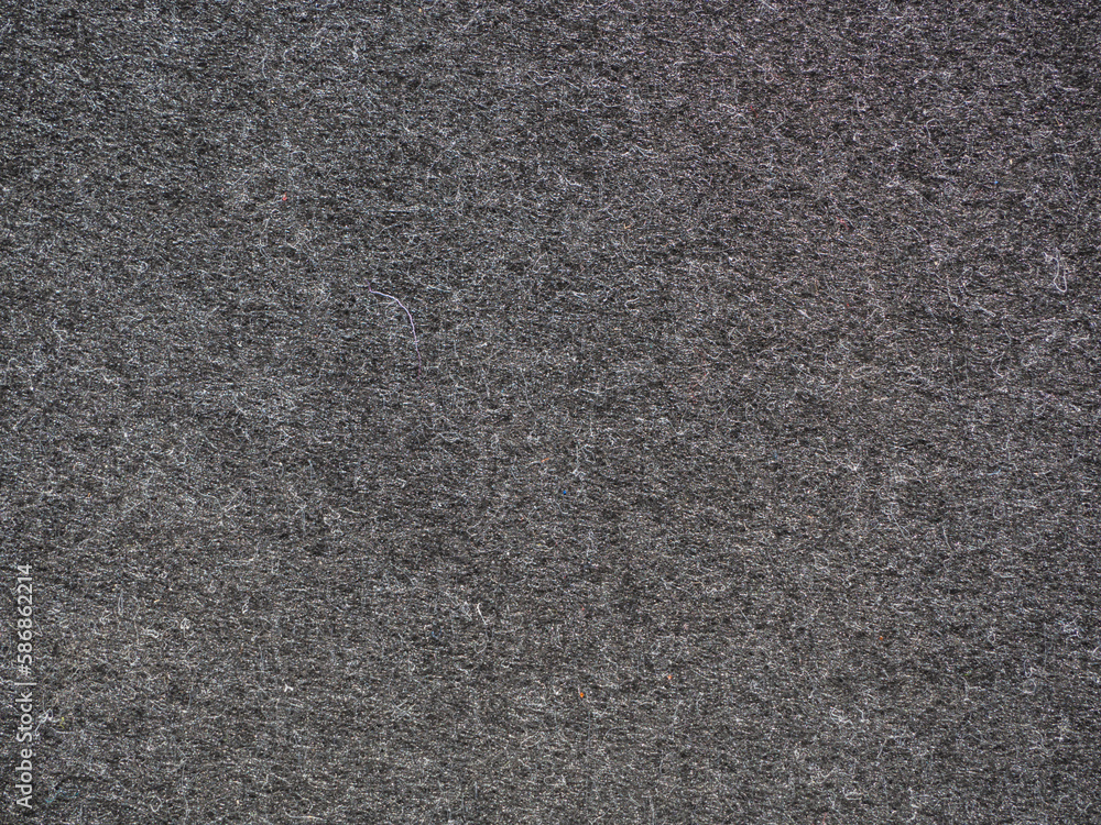 Fototapeta premium Dark texture- felt fabric in black and gray close-up for background