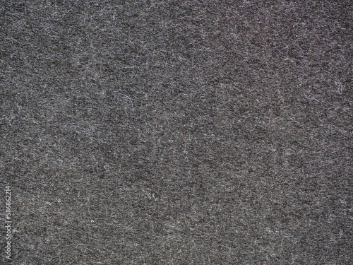 Dark texture- felt fabric in black and gray close-up for background