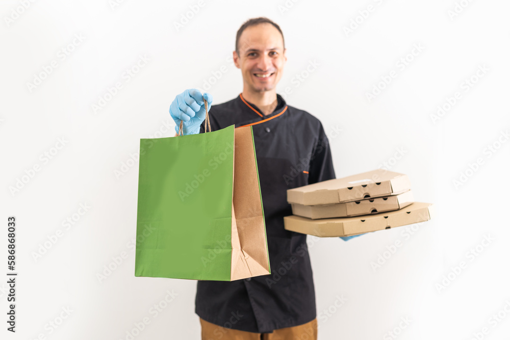 food delivery man wear gloves for cleanliness and hygiene, protect for pandemic and outbreak covid-19 or corona virus, use delivery service in social distancing and quarantine. food delivery man wear gloves for cleanliness and hygiene, protect for pandemic and outbreak covid-19 or corona virus, use delivery service in social distancing and quarantine.