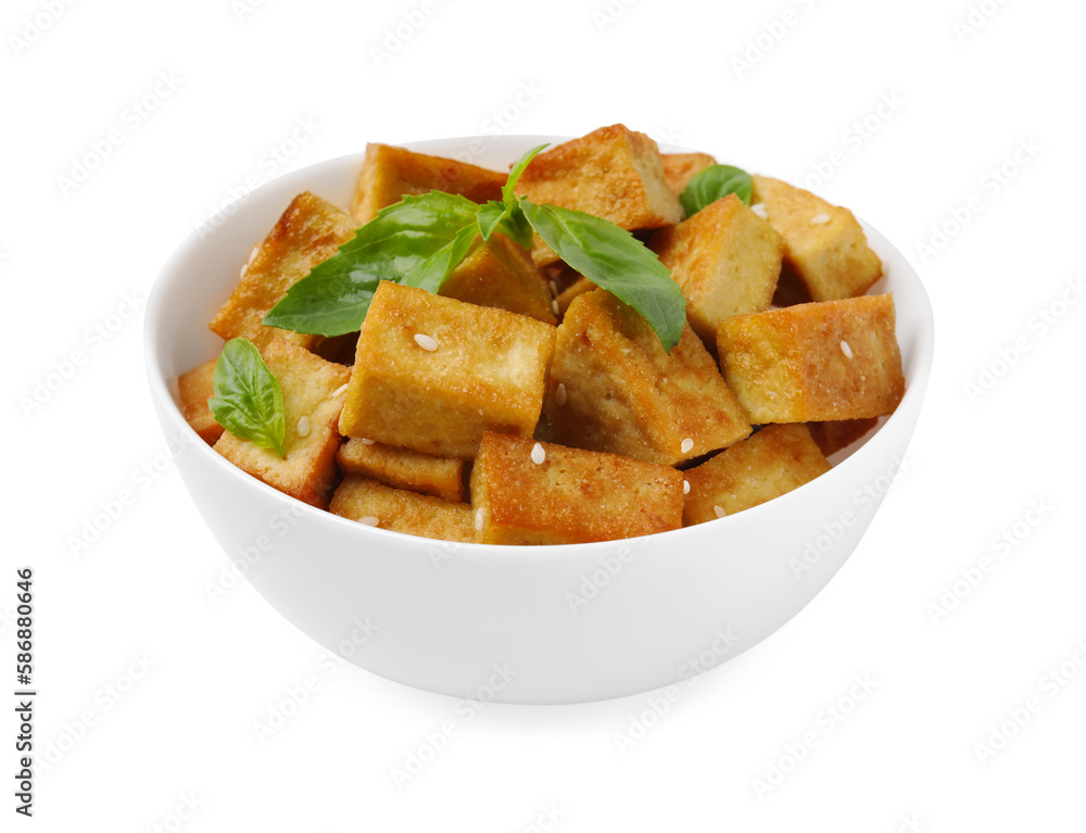 Plate with delicious fried tofu, basil and sesame seeds isolated on white Plate with delicious fried tofu, basil and sesame seeds isolated on white