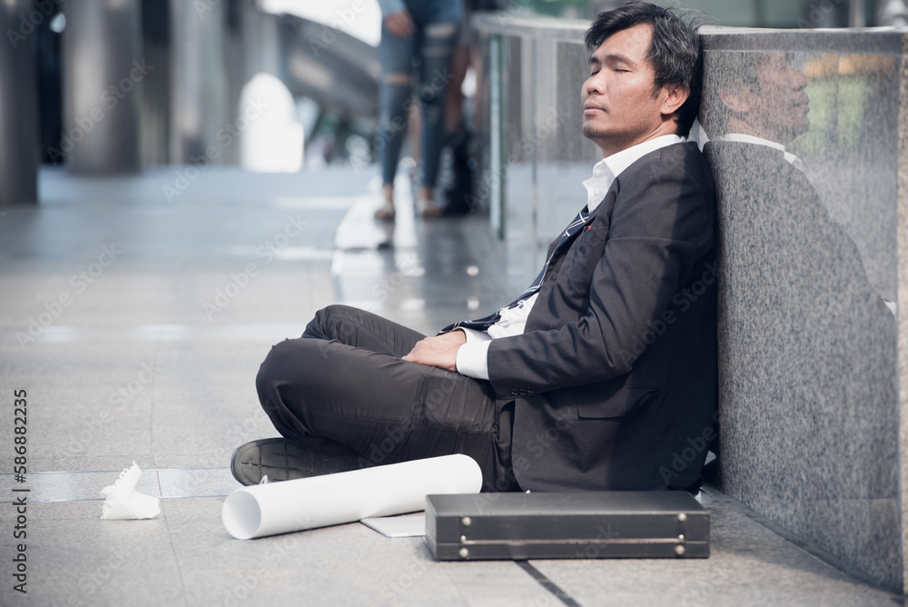 business man in suit frustrated he sad for lost work job sit on street upset fail unhappy after Fired from covid19. Many employee unemployed to reduce expenses salary income dismissal business man in suit frustrated he sad for lost work job sit on street upset fail unhappy after Fired from covid19. Many employee unemployed to reduce expenses salary income dismissal