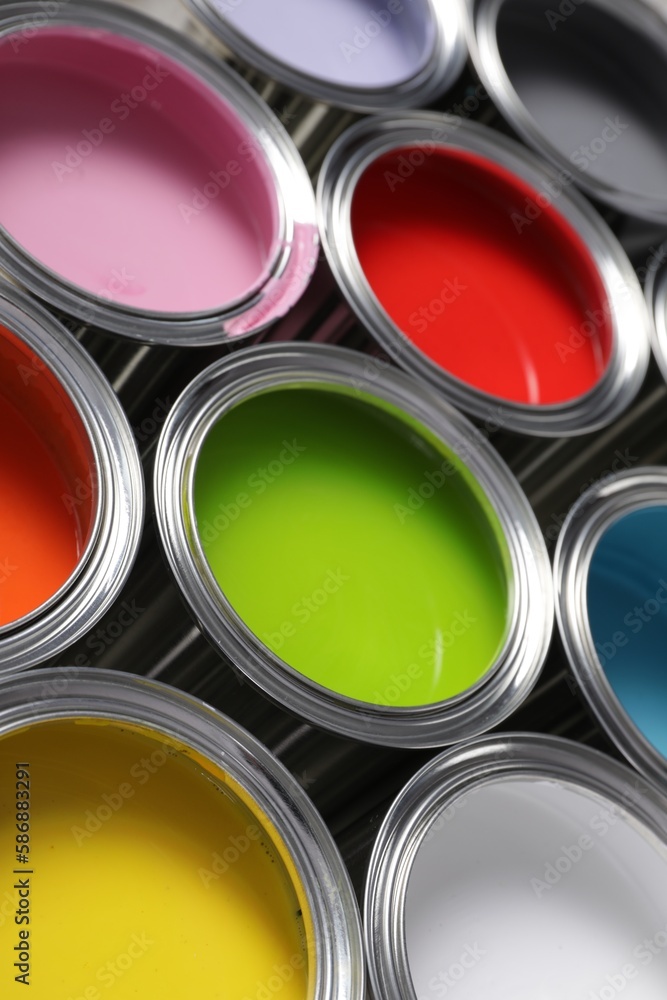 Fototapeta premium Cans of different colorful paints as background