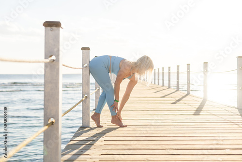 woman exercising on pontoon Red Sea