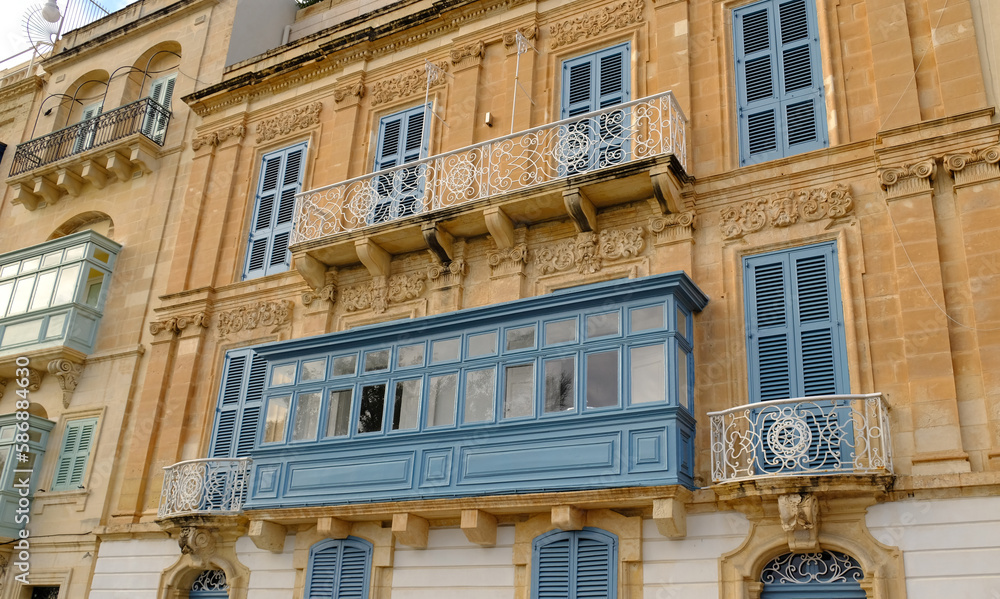 Fototapeta premium Typical residential houses in Malta with colorful wooden balconies