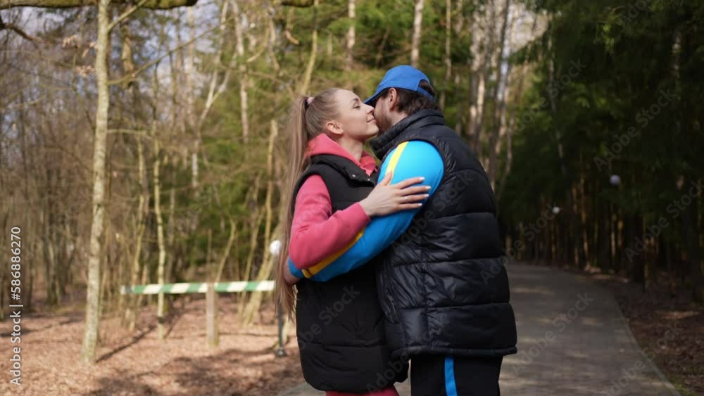 A young couple in love tenderly embrace on a walk in the forest A young couple in love tenderly embrace on a walk in the forest