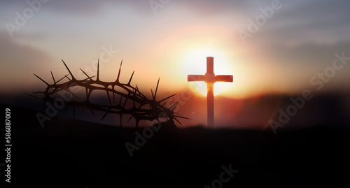 The sunset sky, the cross symbolizing the suffering and resurrection of Jesus Christ, the crown of thorns, and the background concept of Lent, Passion Week, and Easter