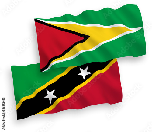 Flags of Federation of Saint Christopher and Nevis and Co-operative Republic of Guyana on a white background