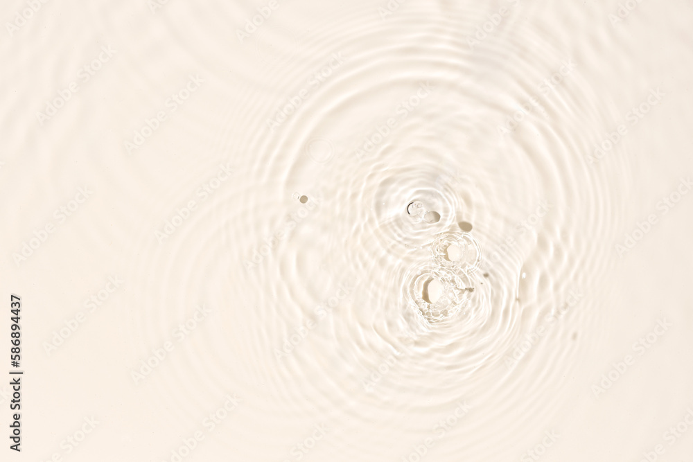 Water surface abstract background texture with splashes and bubbles. Beige color Water surface abstract background texture with splashes and bubbles. Beige color