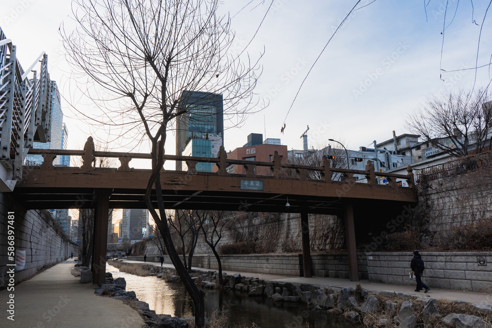 Cheonggyecheon Stream Canal and Supyogyo Bridge in Seoul during winter evening at Jongno-gu , Seoul South Korea : 2 February 2023 Cheonggyecheon Stream Canal and Supyogyo Bridge in Seoul during winter evening at Jongno-gu , Seoul South Korea : 2 February 2023