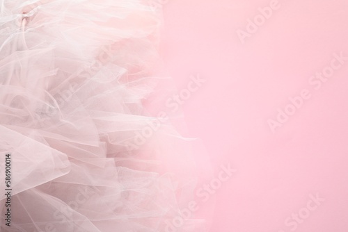 Beautiful tulle fabric on pink background, top view. Space for text © New Africa