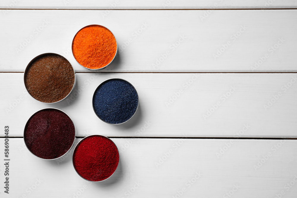 Different food coloring on white wooden table, flat lay. Space for text Different food coloring on white wooden table, flat lay. Space for text