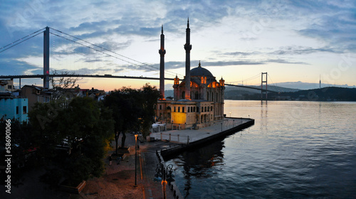 Aerial view of Ortakoy mosque, also known as Buyuk Mecidiye, backgrounded by 15 July Martyrs bridge and Bosphorus strait in Besiktas district, Istanbul, Turkey.