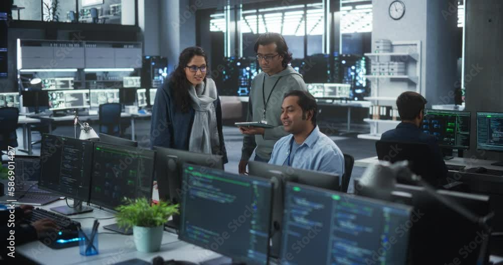 Team of Three Young Indian Software Engineers Use Computer to Discuss a ...