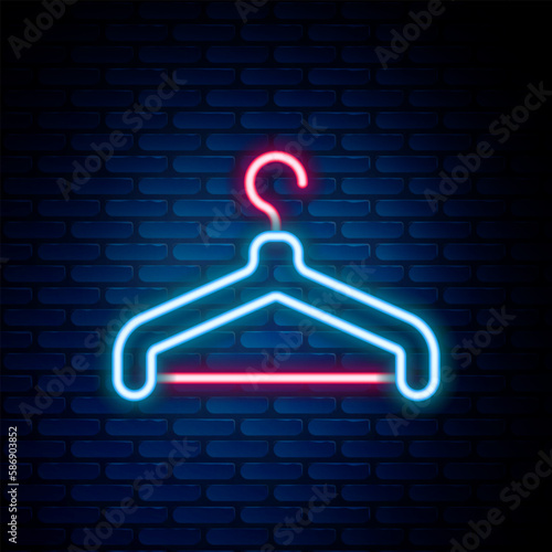 Glowing neon line Hanger wardrobe icon isolated on brick wall background. Cloakroom icon. Clothes service symbol. Laundry hanger sign. Colorful outline concept. Vector