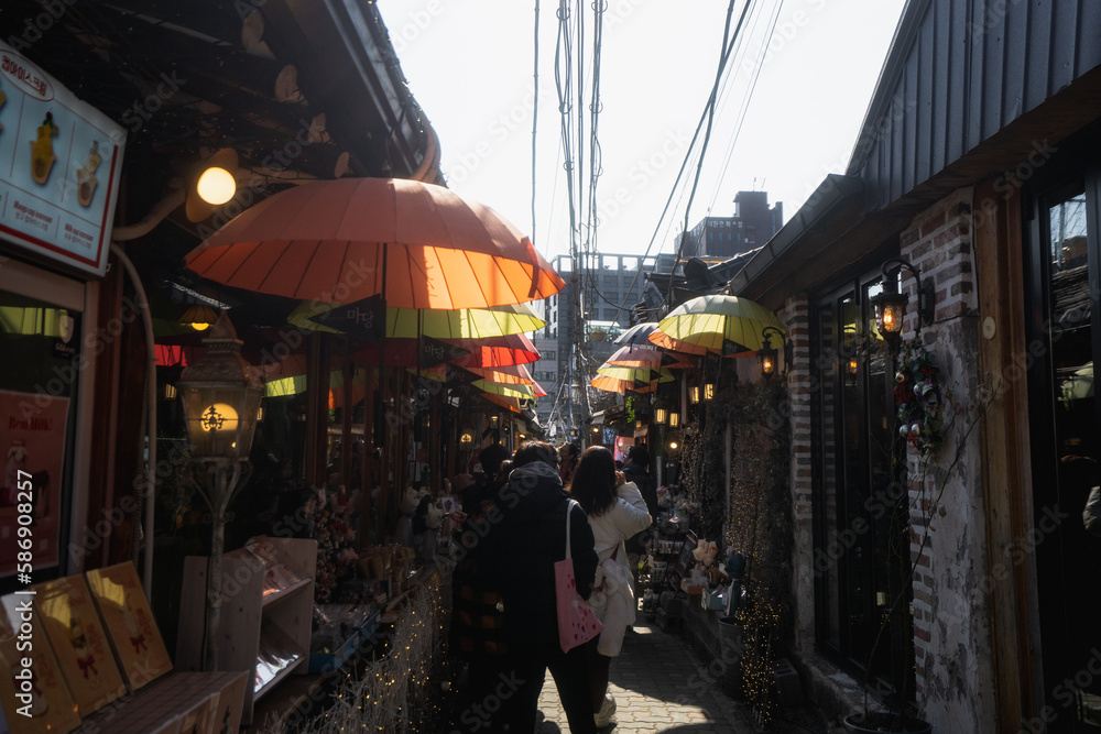 Ikseondong Hanok Village , traditional walking street with umbrellas during winter afternoon at Ikseondong , Seoul South Korea : 3 February 2023