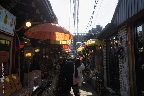 Ikseondong Hanok Village , traditional walking street with umbrellas during winter afternoon at Ikseondong , Seoul South Korea : 3 February 2023