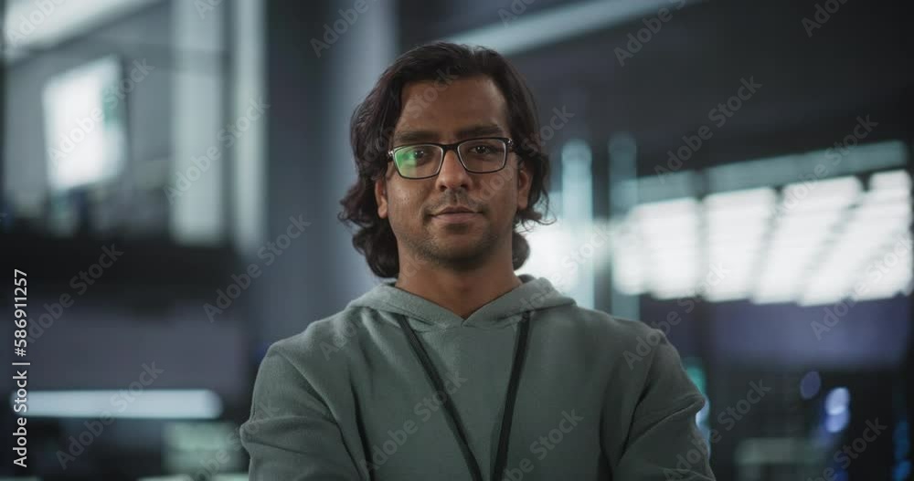 Close Up Portrait of a Talented Indian Man Looking at Camera and Lightly Smiling. South Asian Startup Businessman at Work, Information Technology Manager, Professional Software Developer Close Up Portrait of a Talented Indian Man Looking at Camera and Lightly Smiling. South Asian Startup Businessman at Work, Information Technology Manager, Professional Software Developer