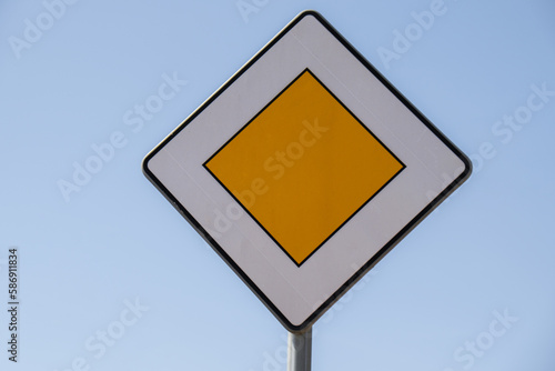 Road sign main road. Speed main road daytime. Road rules International sign Main or Priority against blue sky Copy space