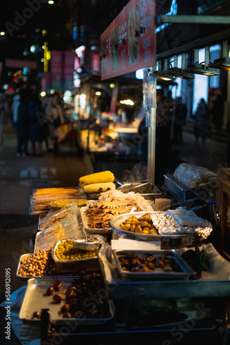 Myeongdong Night Market with Street Food Stalls during winter nights at Jung-gu , Seoul South Korea : 3 February 2023
