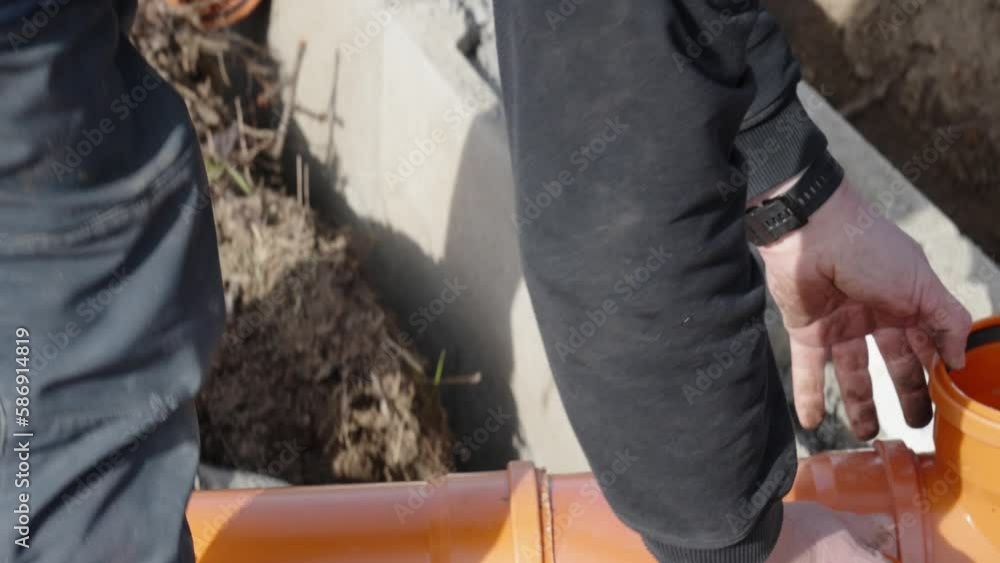 installation of a sewage plastic pipe during the construction of a house installation of a sewage plastic pipe during the construction of a house