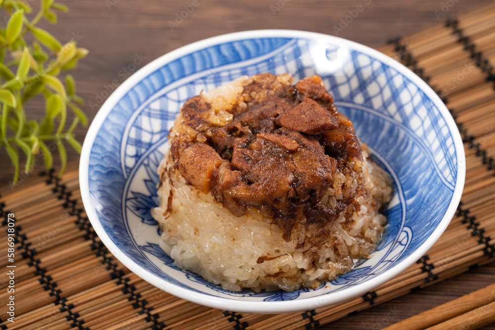 Migao, tube rice cake, rice pudding in a bowl, delicious Taiwanese street food. Migao, tube rice cake, rice pudding in a bowl, delicious Taiwanese street food.