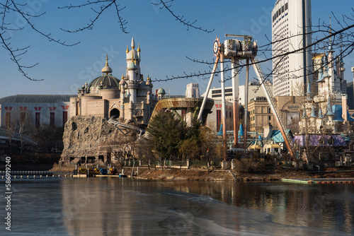 Photography Seokchon Lake Park with Seoul Sky and Lotte World's Magic Island during winter e