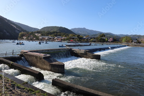 The scene of excursion boats and Hozu-gawa River at Arashiyama in Kyoto City in Japan 日本の京都市嵐山の遊覧舟と保津川 photo