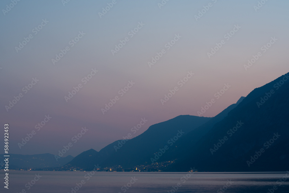 sea and mountains, sunset at a lake. mountain sillhoutte 