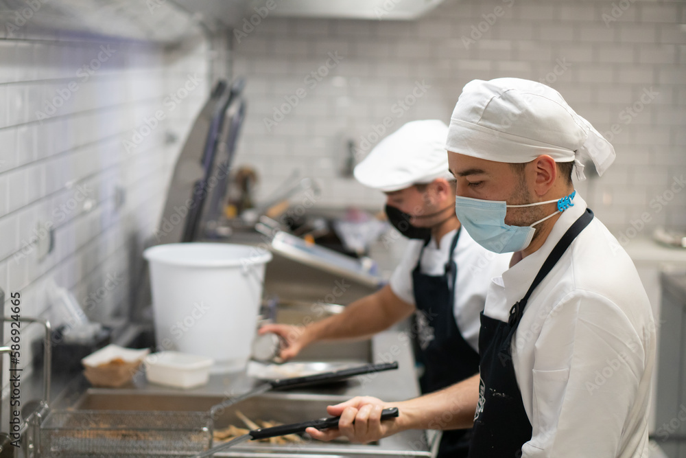 Chefs making food and cooking in a business. Work and kitchen concept. Chefs making food and cooking in a business. Work and kitchen concept.