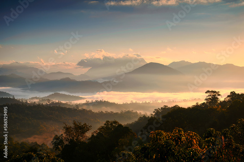 Sunrise over Doi Luang Chiang Dao mountain and foggy flowing on hill in national park