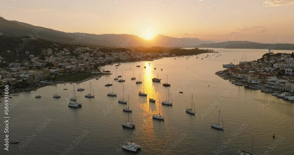 Poros island, Greece. Sailing yacht in marina at sea Aerial view sunset