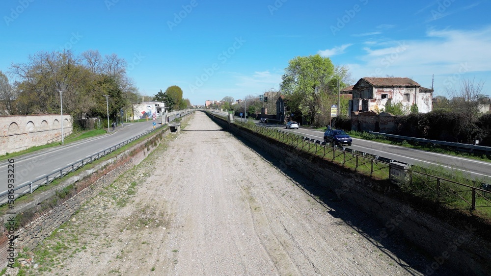 Italy , Milan 2023  -  Drone aerial view of drought and aridity in Navigli canal river  - water emergency and reduction of water consumption - Climate change global warming 