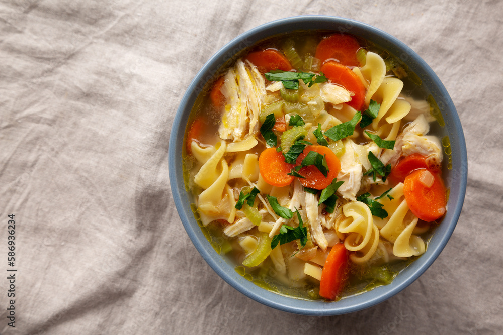 Homemade Chicken Noodle Soup in a Bowl, top view. Flat lay, overhead, from above. Copy space. Homemade Chicken Noodle Soup in a Bowl, top view. Flat lay, overhead, from above. Copy space.