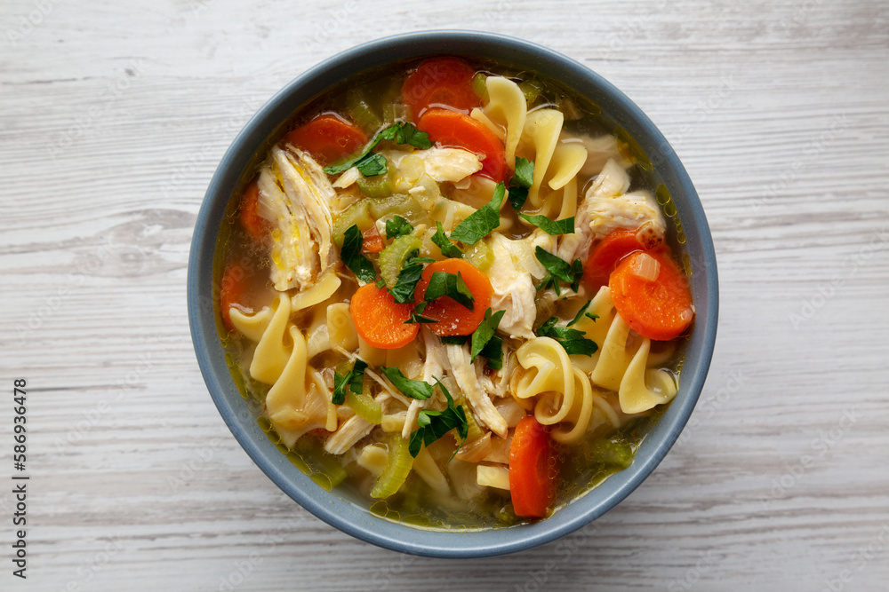 Homemade Chicken Noodle Soup in a Bowl, top view. Flat lay, overhead, from above. Homemade Chicken Noodle Soup in a Bowl, top view. Flat lay, overhead, from above.