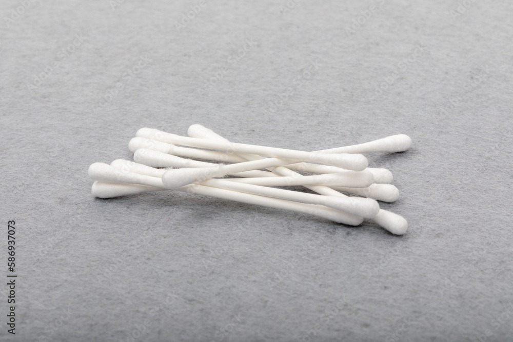 Hygiene and Cleanliness: Close-up of cotton swabs on Grey Felt Mat Hygiene and Cleanliness: Close-up of cotton swabs on Grey Felt Mat