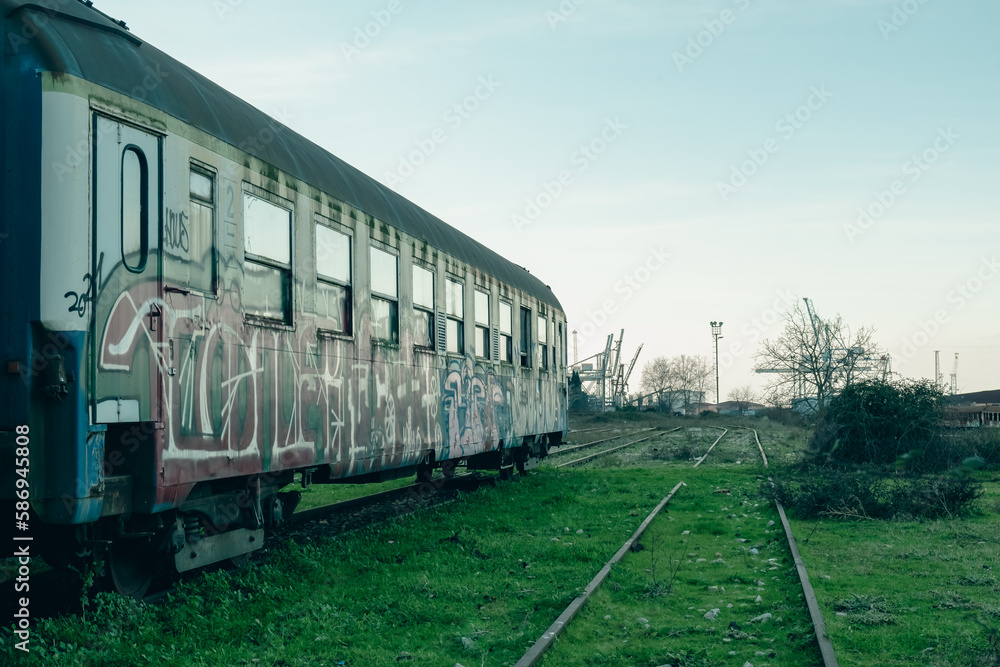 A train with graffiti on the side of it, cinema style editing A train with graffiti on the side of it, cinema style editing
