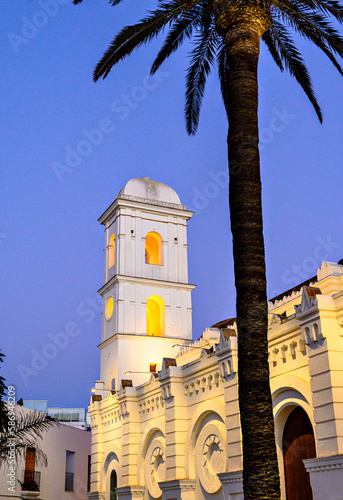 Vertical sunset shot of the Iglesia de Santa Catalina in Conil de la Frontera, Cadiz, Spain.