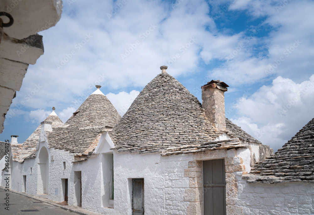 Beautiful street in the center of the village of Alberobello with trulli scattered everywhere