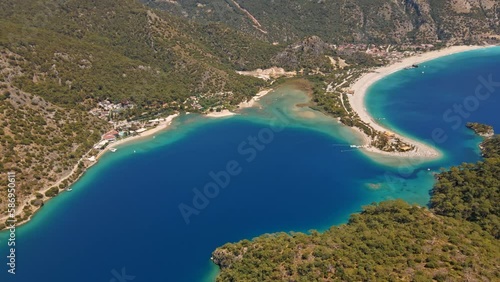 Oludeniz is a resort village on the southwest coast of Turkey. known for the blue lagoon of Oludeniz Tabiat Parki and the wide, white Belcekiz Beach. photo