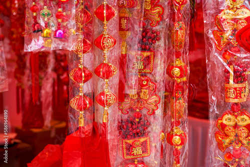 Various festive items sold at the Chinese New Year market. Translation: Happy New Year, peace in and out, various blessings.