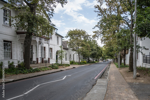 tree-lined street among traditional picturesque houses  Stellenbosch  South Africa