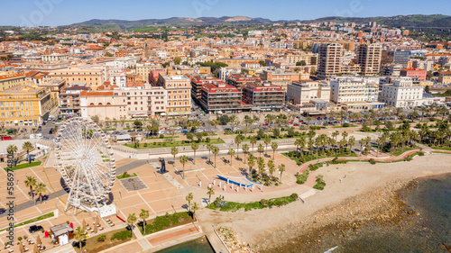 Photography Aerial view of the Ferris wheel located on the waterfront of Civitavecchia in the Metropolitan City of Rome, Italy