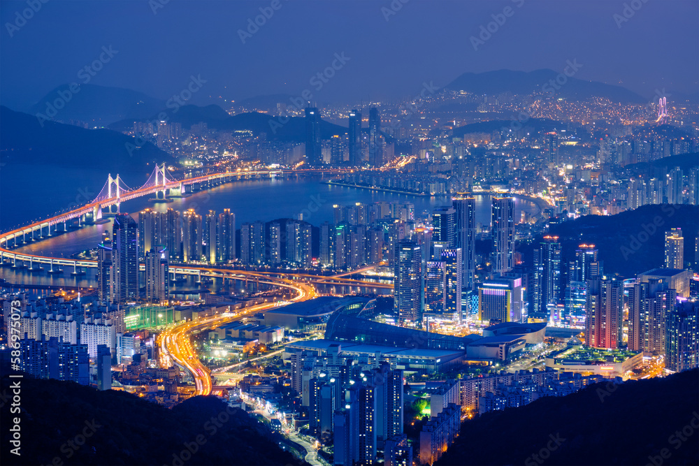 Busan cityscape with skyscrapers and Gwangan Bridge illuminated at night. Busan. South Korea