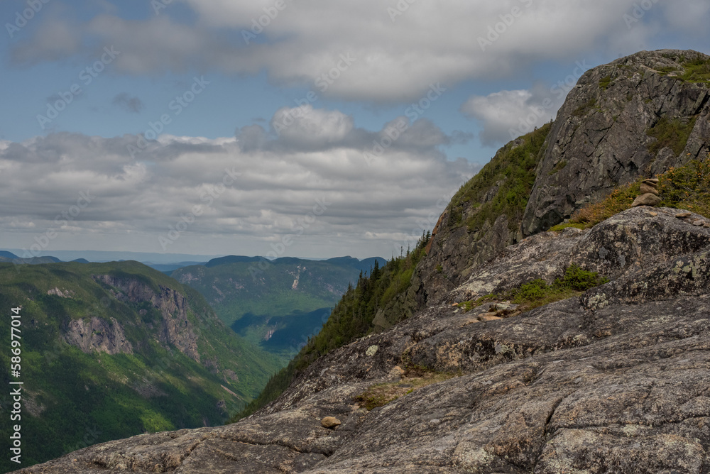 Landscape with rocky mountains and forest, Acropole des Draveurs, Quebec, Canada, beautiful sky with clouds